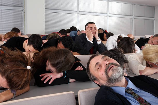 People sleeping at business seminar, only one is still awake. Minilypse Ljubljana 2008